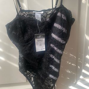 Size XS, no tears. Never worn.